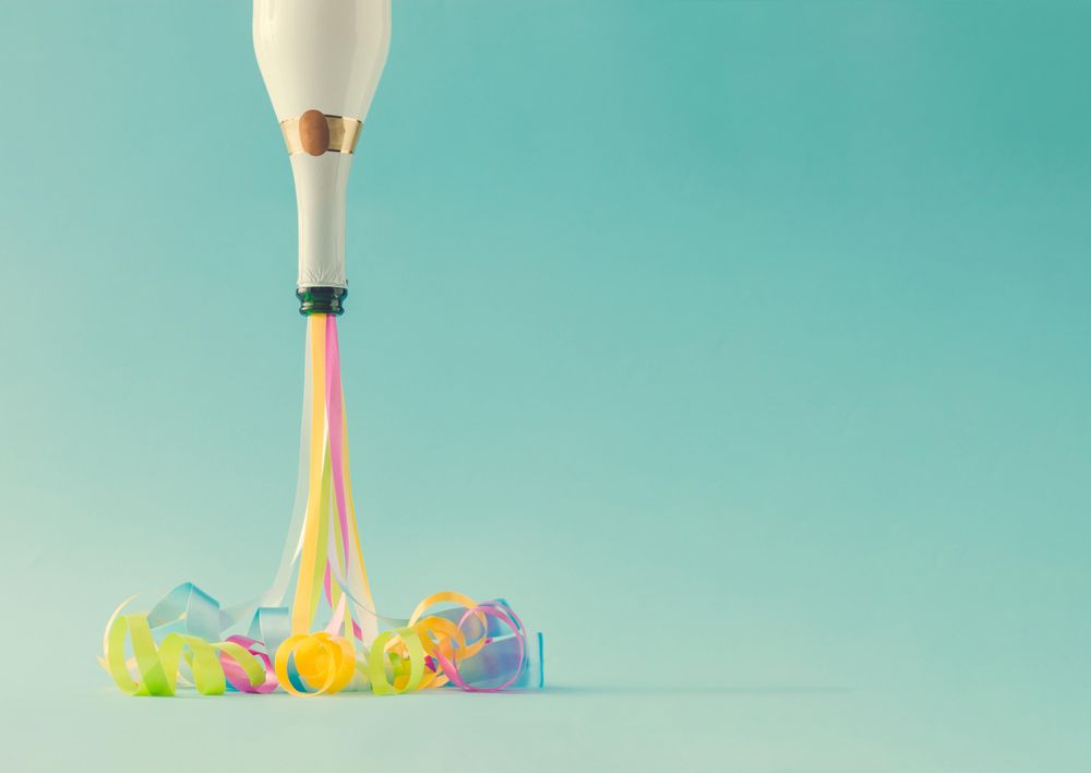Champagne bottle with party streamers