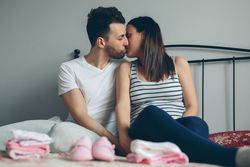Man kissing his pregnant wife