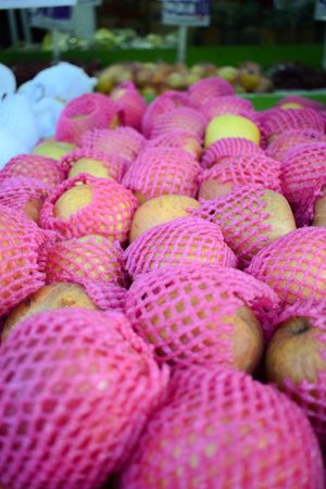 Pear fruits wrapped and for sale in market