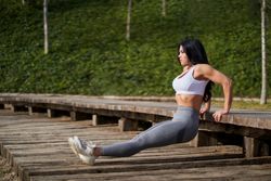 Slim woman doing yoga in park