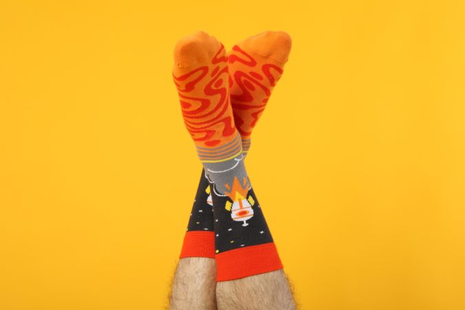 Casual clothes and wearing concept - socks, clothes for foot