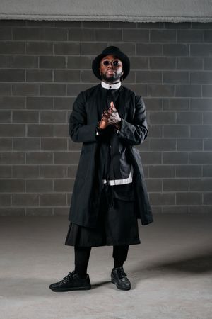 Stylish Black man in sunglasses and hat