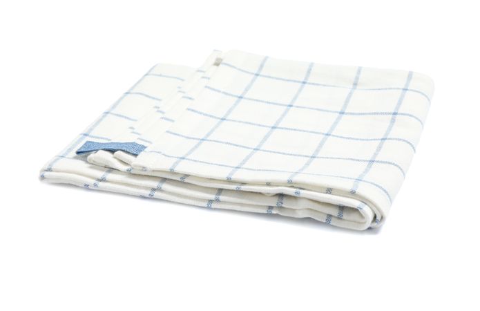 Folded fabric napkin isolated on plain background