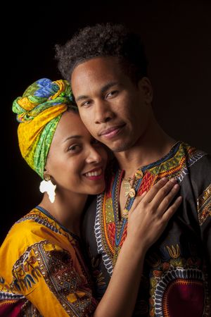 Black man smiling and looking at camera