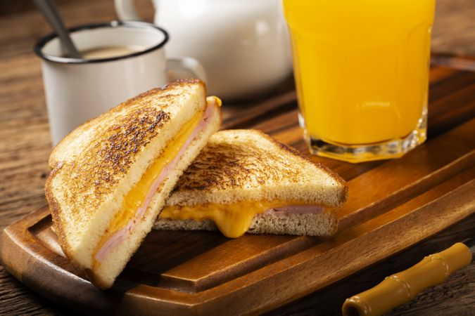 Grilled ham and cheese. Sandwich with cheese and ham on grill.