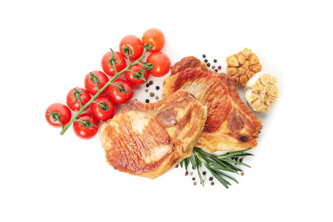 Fried steaks isolated on blank background. Grilled food
