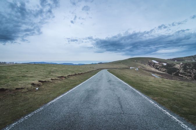 Asphalt road in hilly countryside