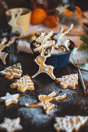 Ginger cookies shaped into reindeer, Christmas trees, and stars