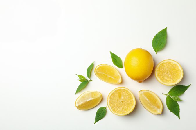 Fresh lemons on light background, top view. Ripe fruit