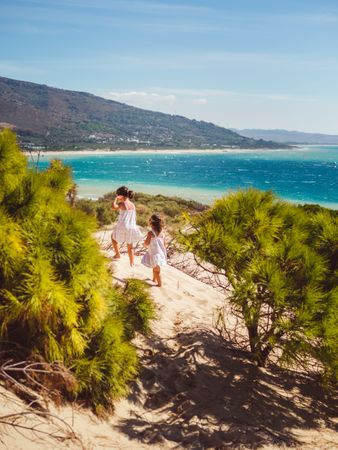 small girls having a stroll at beach