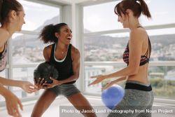 Women enjoying exercising with medicine ball at gym 4ZeaqW