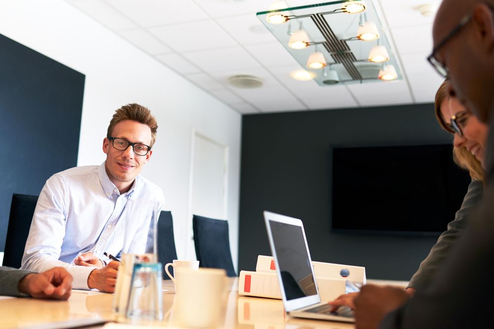 Colleagues in modern meeting room