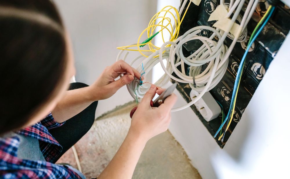 Unrecognizable female technician installing lan network