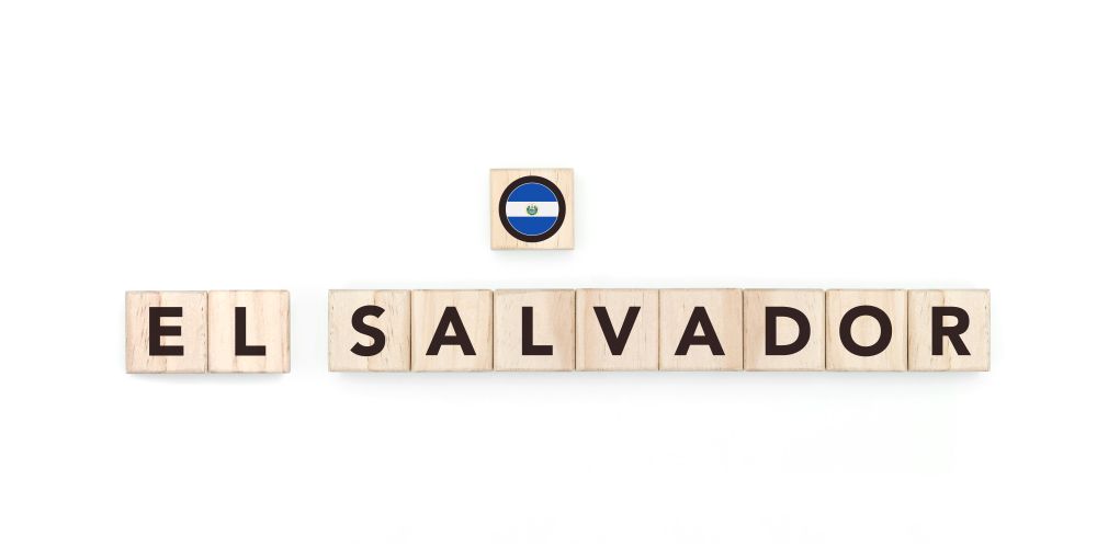 Wooden blocks bearing the name and flag of El Salvador . Salvadoran and American Culture, national identity, travel, and geography in a copy space design.