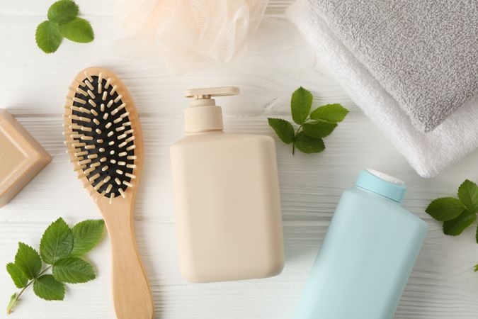 Composition with hair care products on wooden background, top view