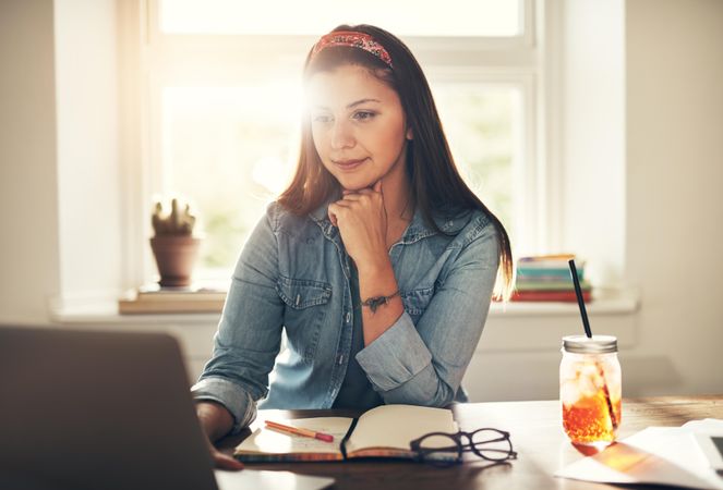 Woman in study with ice tea