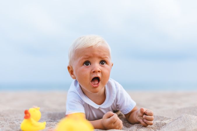 Baby boy playing with rubber ducks