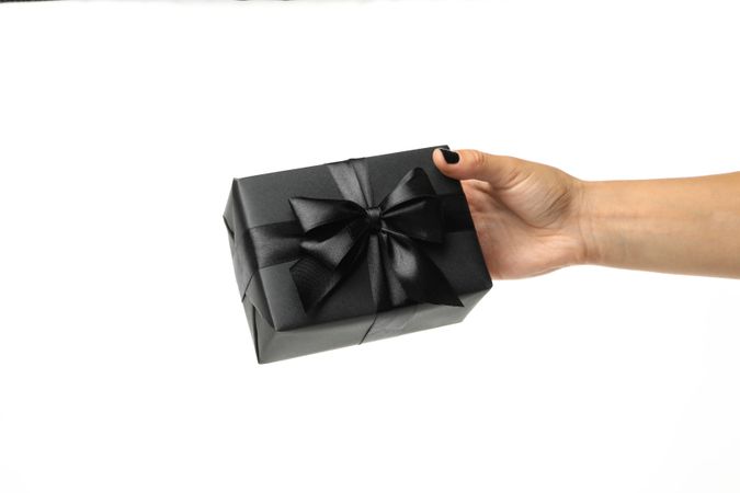 Female hand hold gift box, isolated on blank background