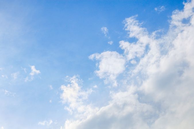 Clouds in the blue mid day sky