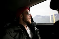 Male in sunglasses enjoying scenery from vehicle