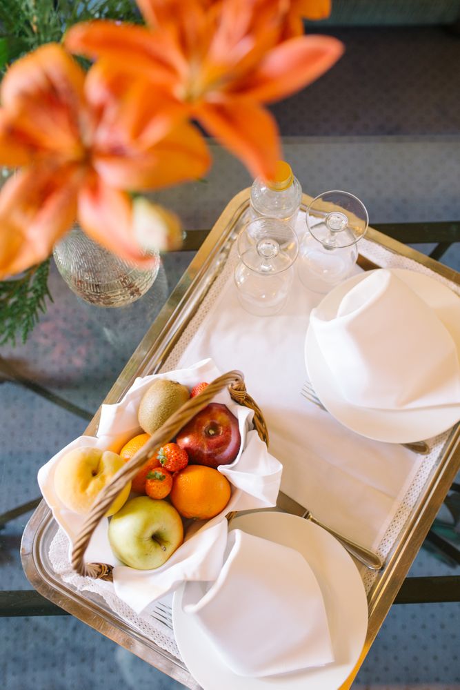 Bouquet and tray on table in hotel room