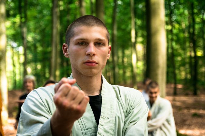 woman practicing martial arts in garden