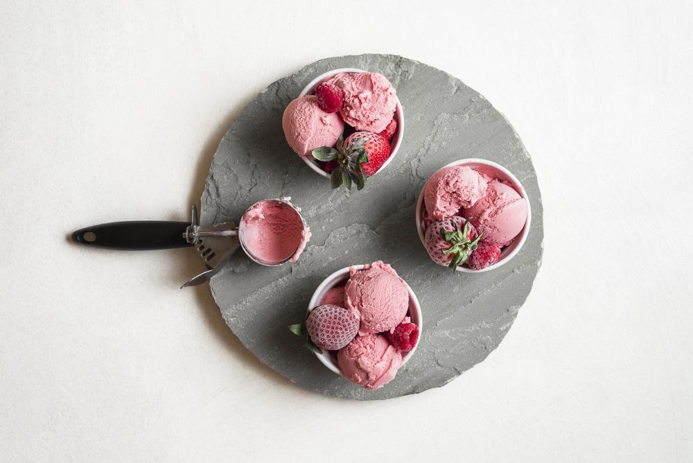 Scooped pink cream on a slab