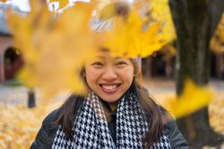 Happy female tourist enjoying autumn in Oslo
