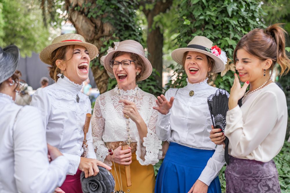 Vintage female friends speaking in garden
