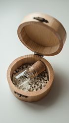 Flash drive in original glass packaging in wooden box