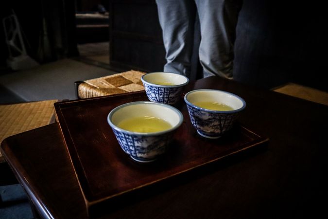 Japanese tea on wooden tray on a table