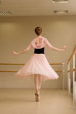 Ballet dancer performing pirouette en pointe