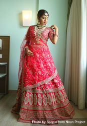 Indian bride wearing red sari indoor 4OG3a4