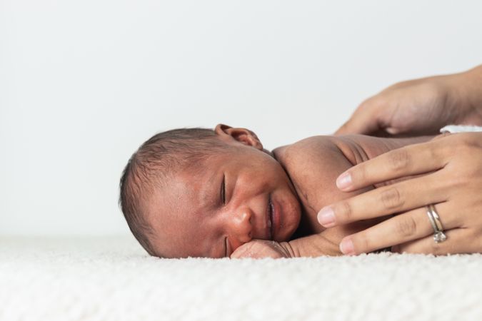Anonymous mother holding newborn baby