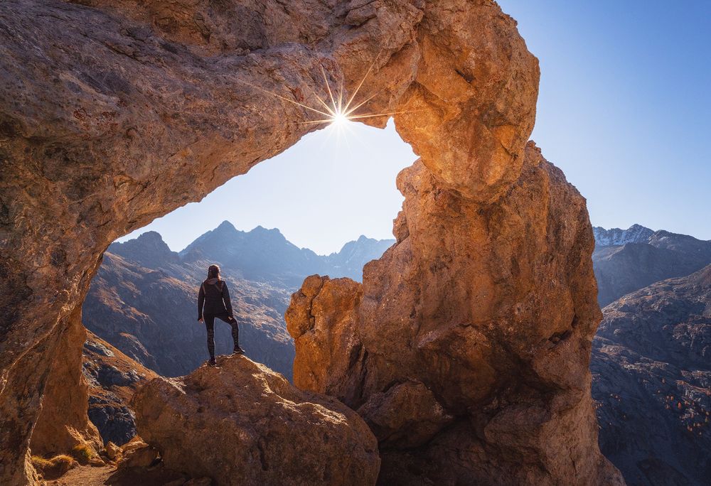 Person standing on rocky mountain