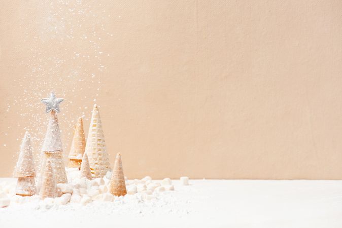 Festive winter trees made of waffle cones, tiny marshmallows and powdered sugar