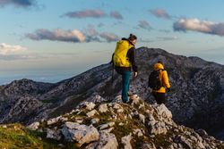 mountaineers hiking on a mountain peak