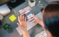Woman in a travel agency booking a trip looking at the denied covid passport