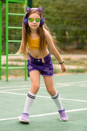 Female child playing on sports ground