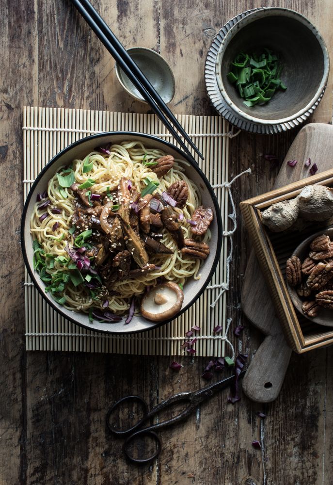 Miso noodles with egg plants and shiitake in bowl on table