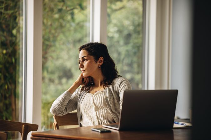 Worried parent working remotely from home