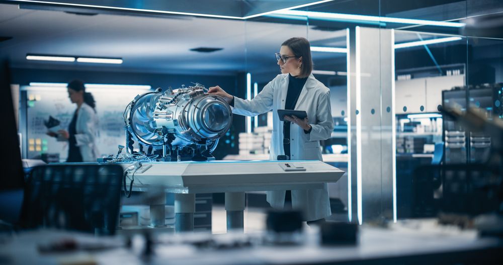 Female Scientist Developing a New Electric Motor in a Research Facility