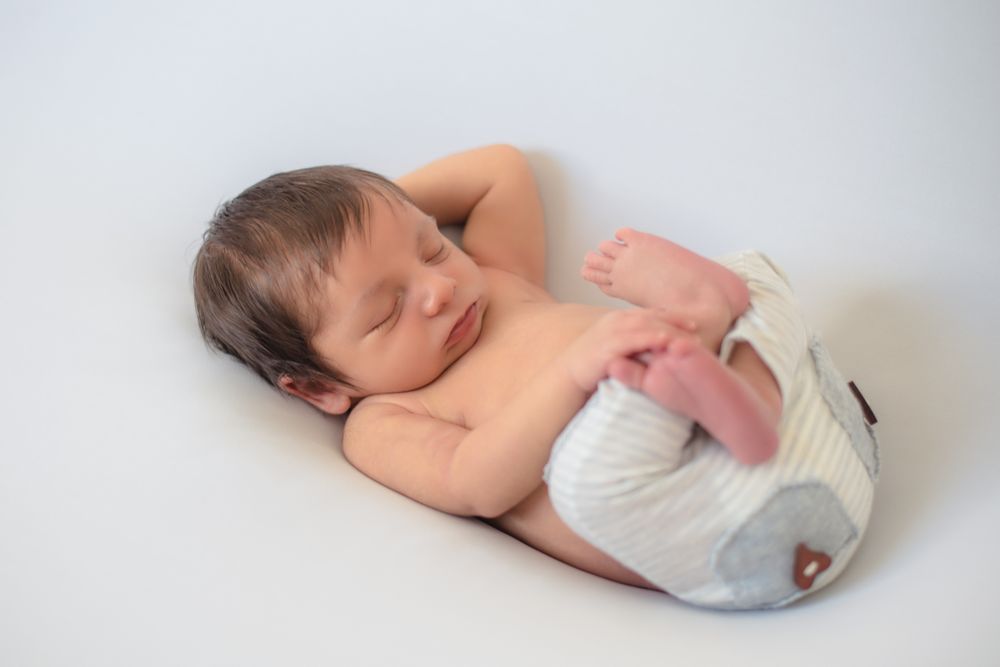 portrait of baby asleep in bed
