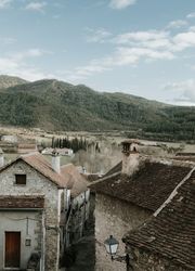 Old buildings in city near mountains