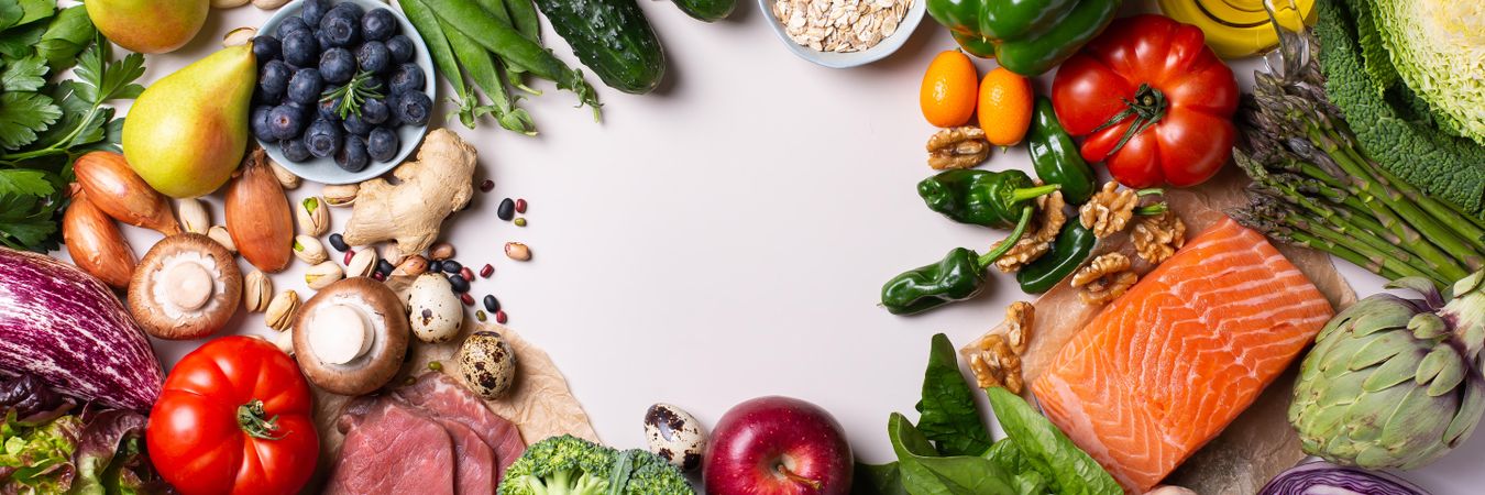 Banner of a healthy food mix fresh vegetables, fruit and fish with copy space in center