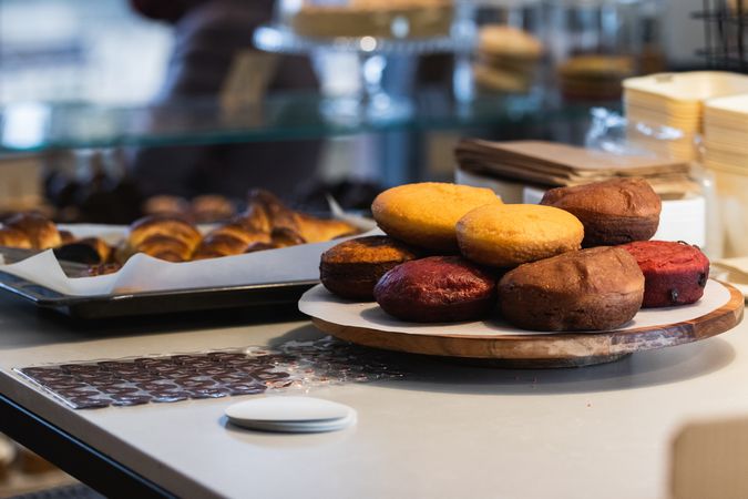 Appetizing sponge cakes in tray in bakehouse