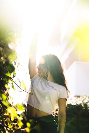 Cheerful woman in garden