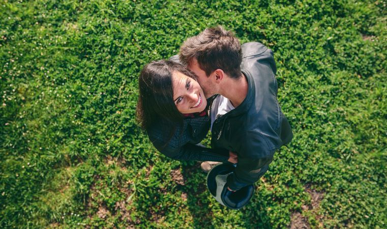 Top view couple hugging outdoors