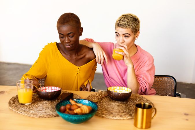 Two females having breakfast together at home