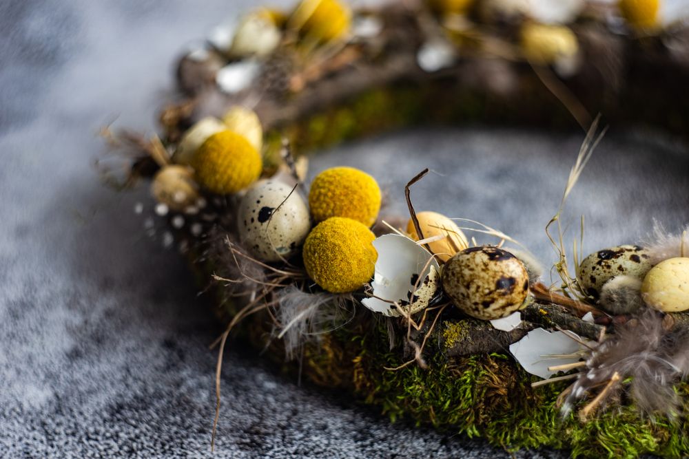 Easter floral composition with delicate eggs on wreath